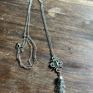 Silver tone long necklace with green bead